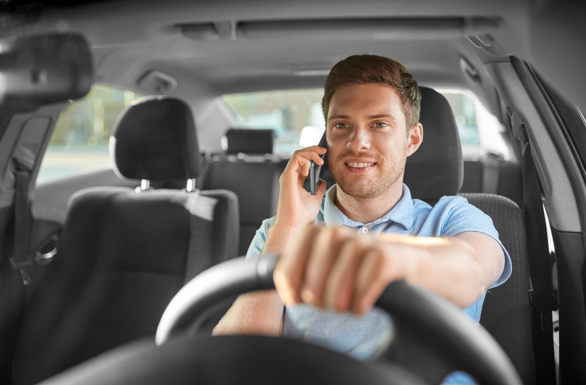 Man driving car while speaking on the phone